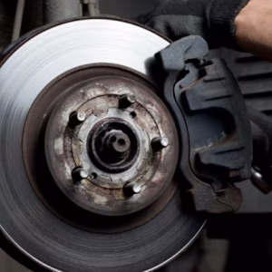 a-mechanic-working-on-a-brake-pad