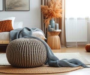 A bold, oversized pouf becomes a focal point in a sleek.